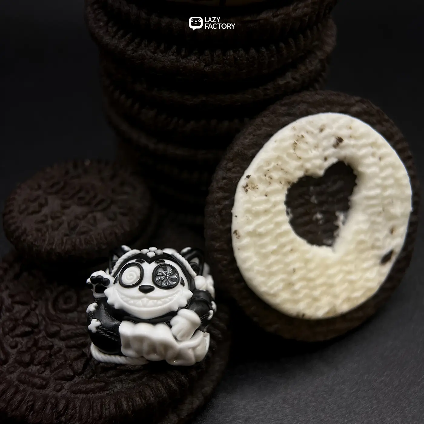 Mono Meowhe artisan keycap staged with black and white sandwich cookies